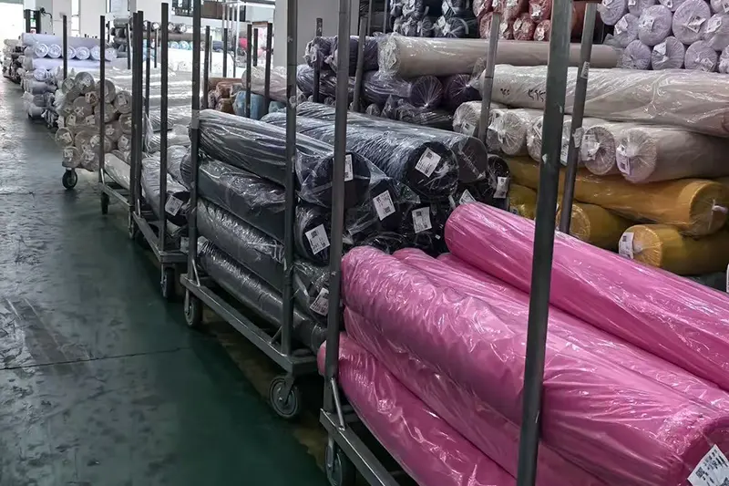 fabric rolls stored for custom shirt production