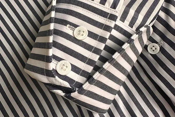 Custom collar and cuff details on tailored business shirts