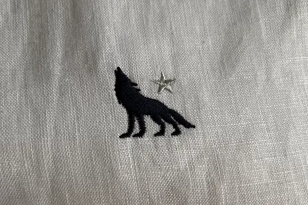 Logo embroidery on custom linen shirts