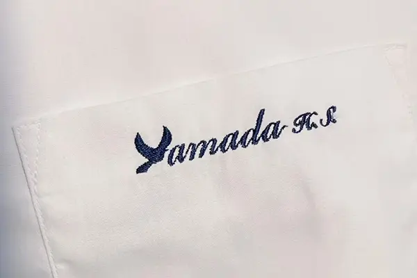 Logo embroidery on custom uniform shirts