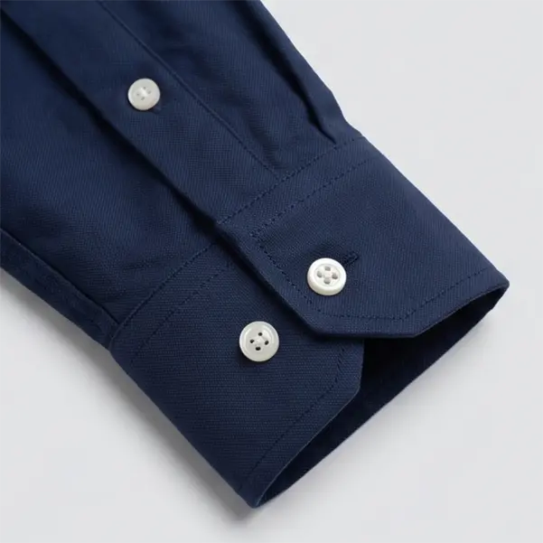 embroidered logo detail on corporate shirt